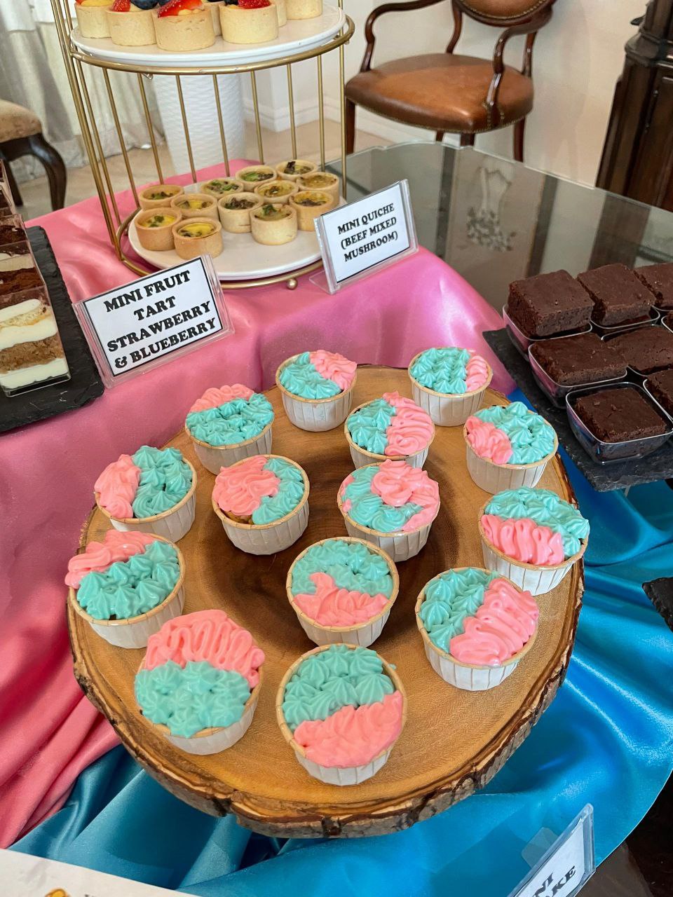 Birthday party catering setup with desserts and hot food stations