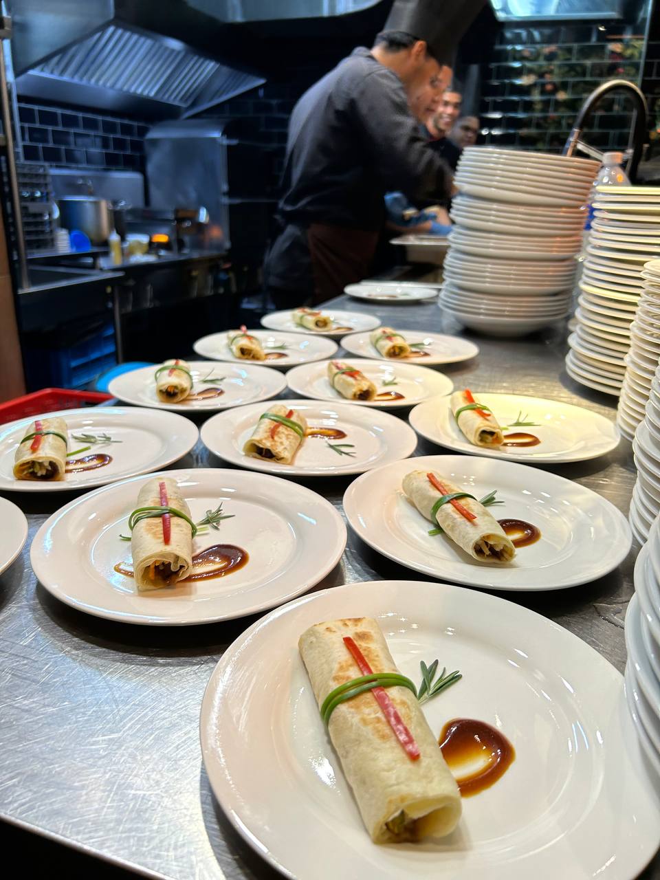 Halal catering buffet with rice, chicken dishes and desserts for office event