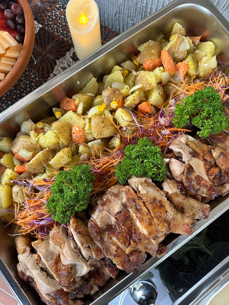 Halal catering buffet with rice, chicken dishes and desserts for office event