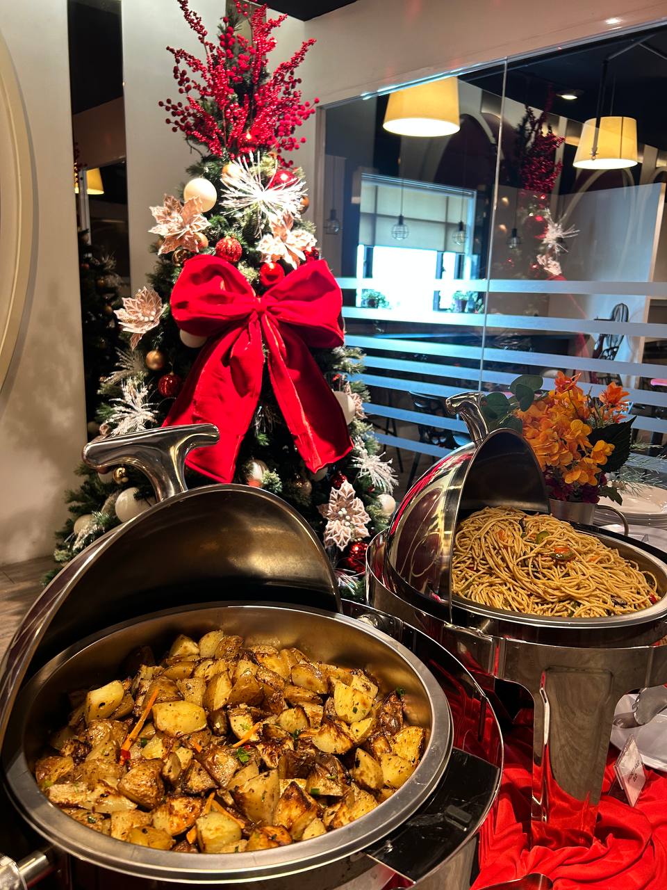 Halal catering buffet with rice, chicken dishes and desserts for office event